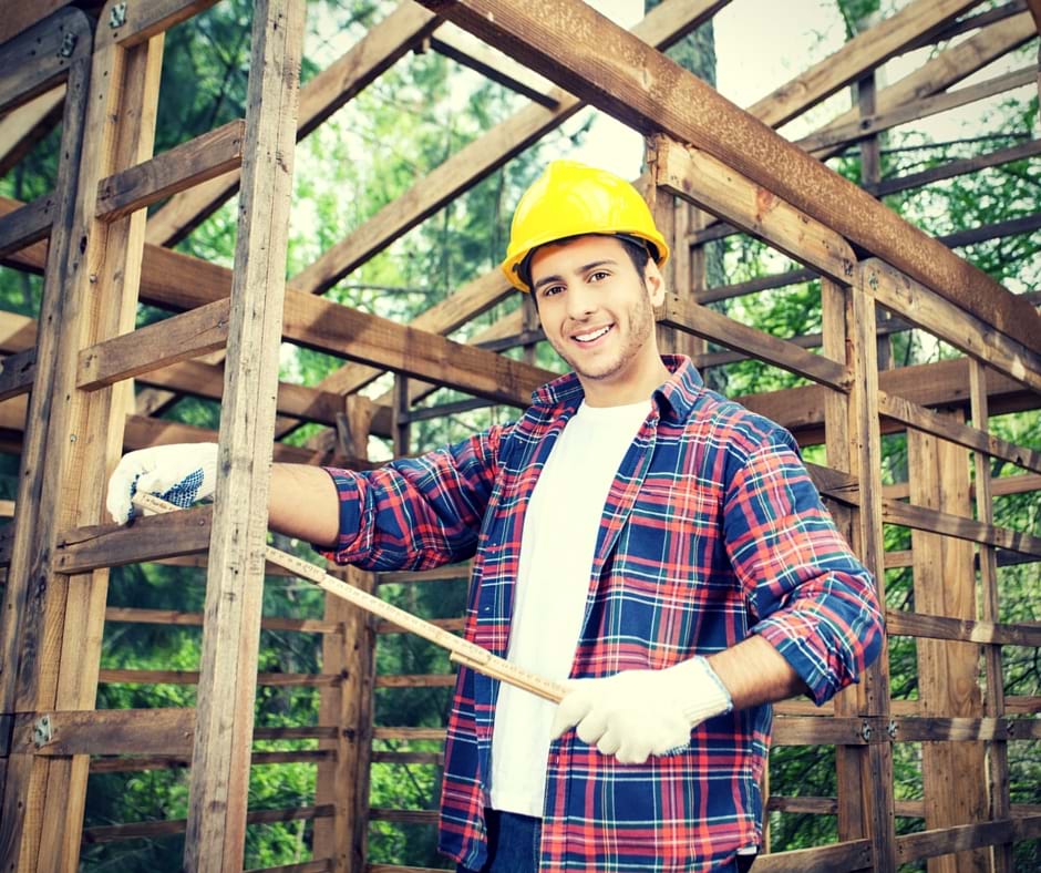 Carpenter putting together a wooden frame