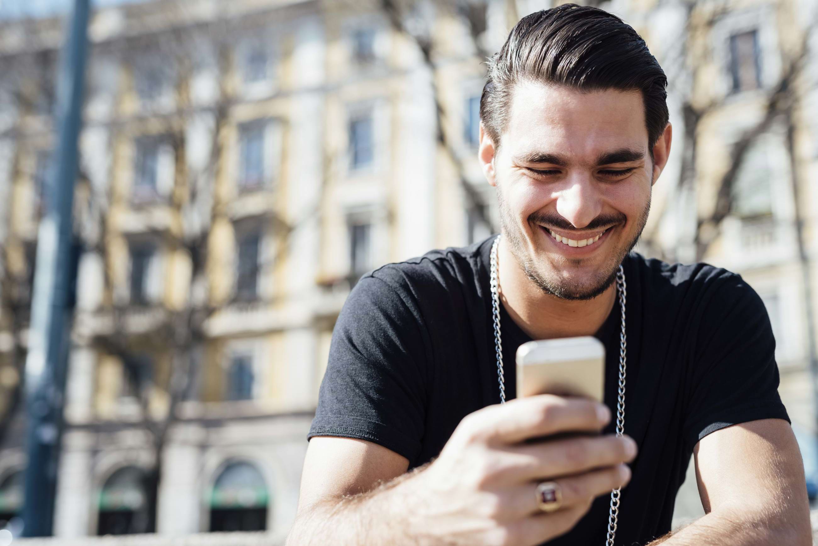 Happy guy on his phone