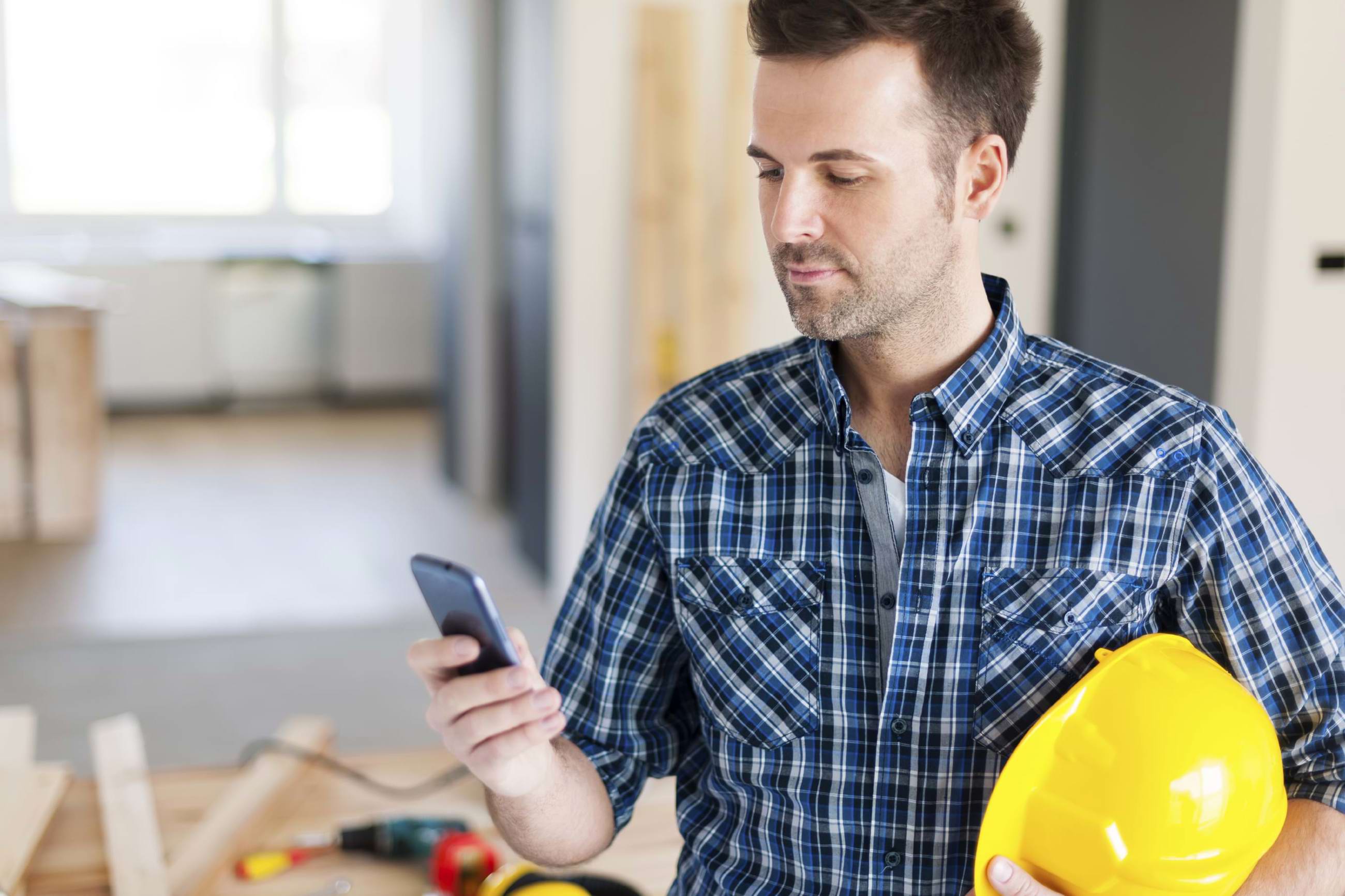Construction worker on his cell phone