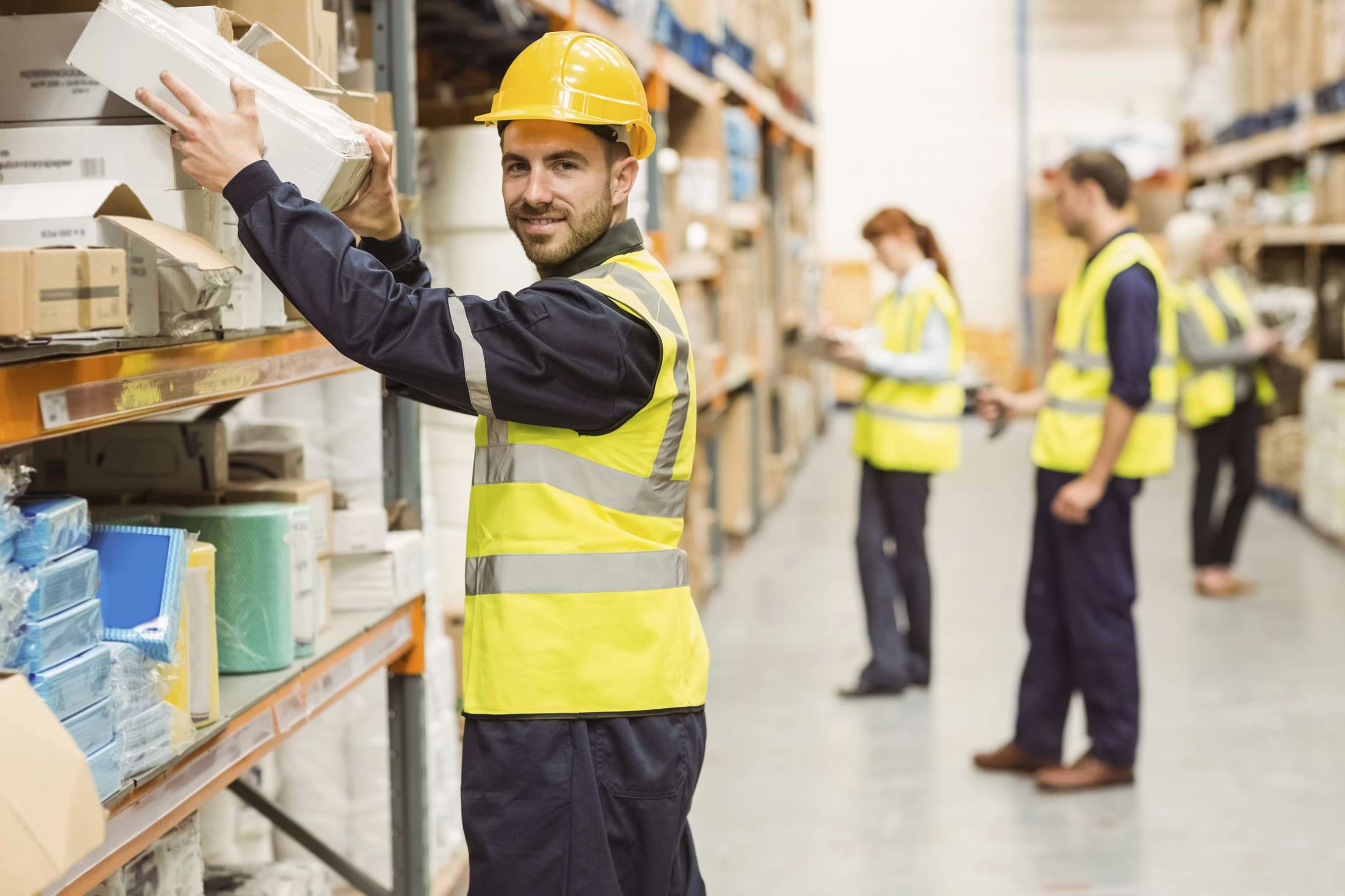 Warehouse workers putting away boxes